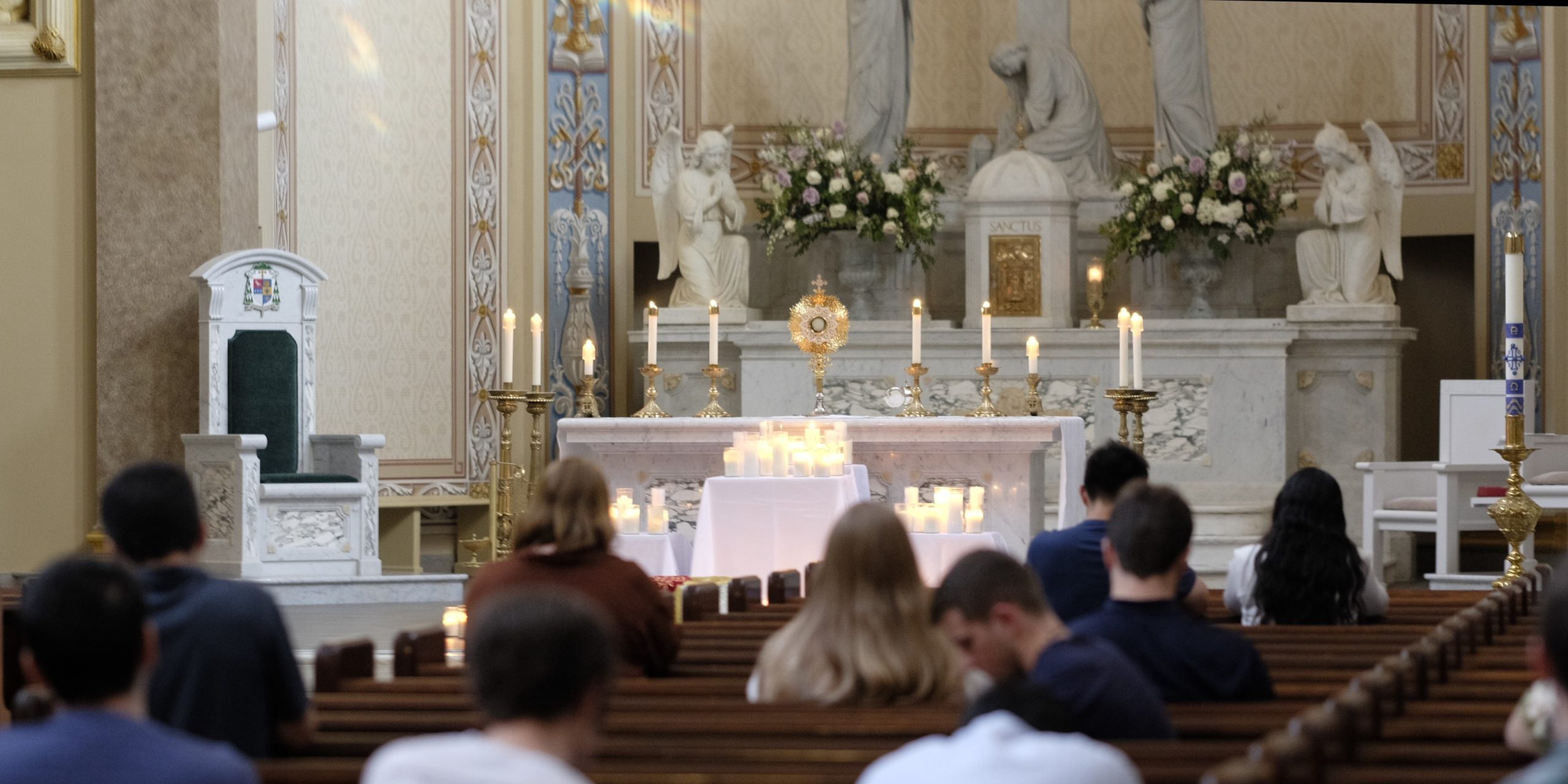 Young adults during Eucharistic Adoration.